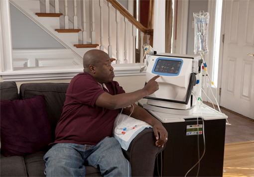 Man using his NxStage Home Hemodialysis System.
