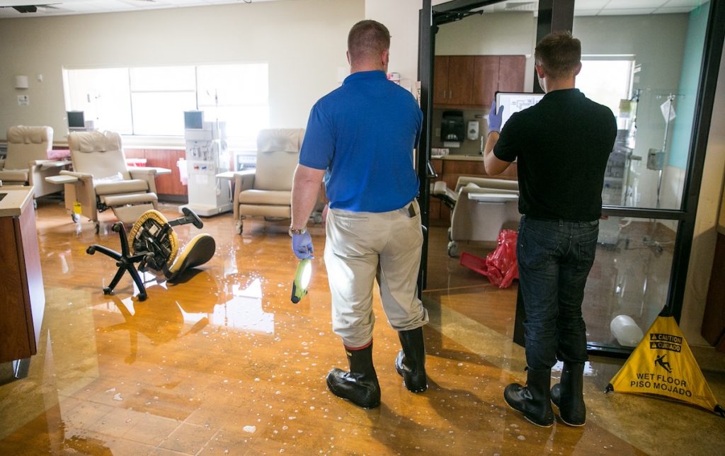Disaster Team members document flood damages in the dialysis clinic. 