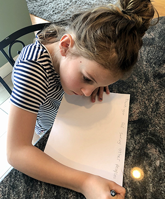 Ari working on her letter to the Fresenius Medical Care team. 